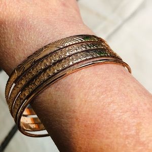Set of 4 gold tone bangle bracelets